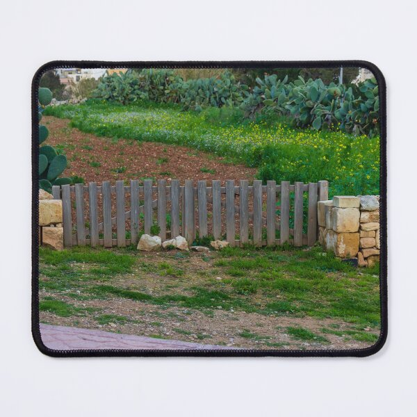 Item preview, Rustic Wooden Gate Between Stone Walls Leading To Green Field With Cactus In Rural Village designed and sold by Nmallia.