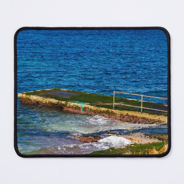 Item preview, Moss-Covered Concrete Pier With Rusty Railing and Waves on a Blue Mediterranean Sea Shore designed and sold by Nmallia.
