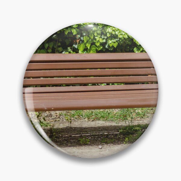Item preview, Empty Wooden Park Bench Against Ivy Hedge in Sunny Outdoor Garden Seating Area for Relaxation designed and sold by Nmallia.