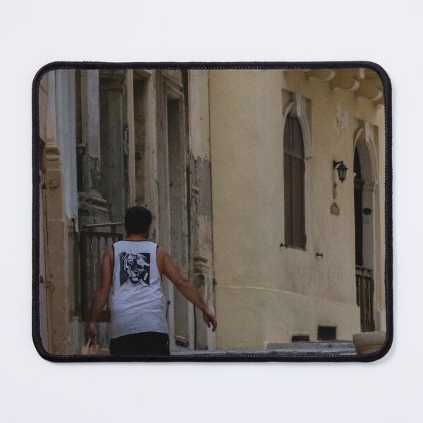 Item preview, Man Walking Up Historic Stone Steps Through Narrow Old Town Street With Warm Mediterranean Architecture designed and sold by Nmallia.