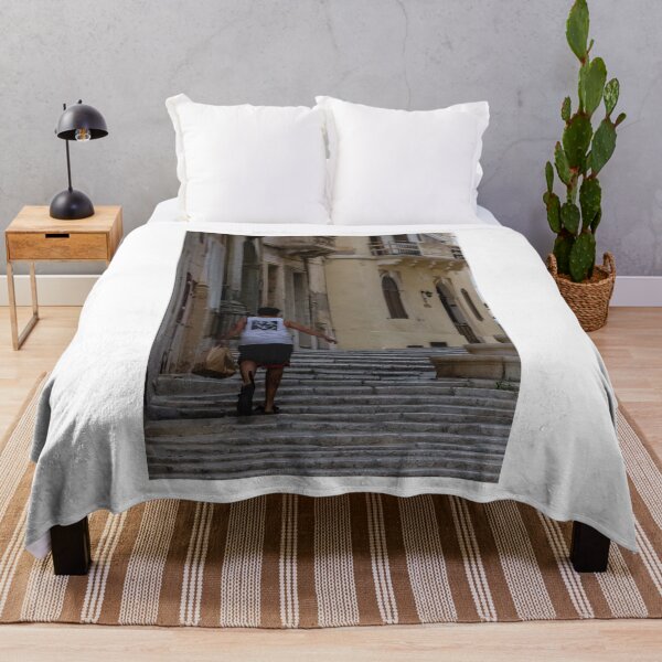 Item preview, Man Walking Up Historic Stone Steps Through Narrow Old Town Street With Warm Mediterranean Architecture designed and sold by Nmallia.