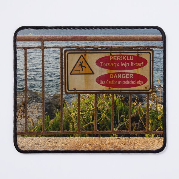 Item preview, Danger Sign On Rusty Railing Over Coastal Cliff With Sea View At Sunset designed and sold by Nmallia.