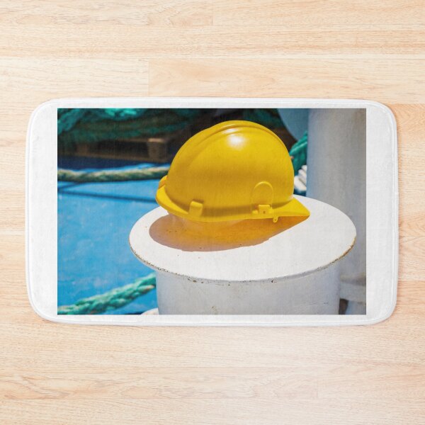 Item preview, Yellow Safety Hard Hat Resting on Ship Deck Bollard With Coiled Ropes - Marine Safety Concept designed and sold by Nmallia.