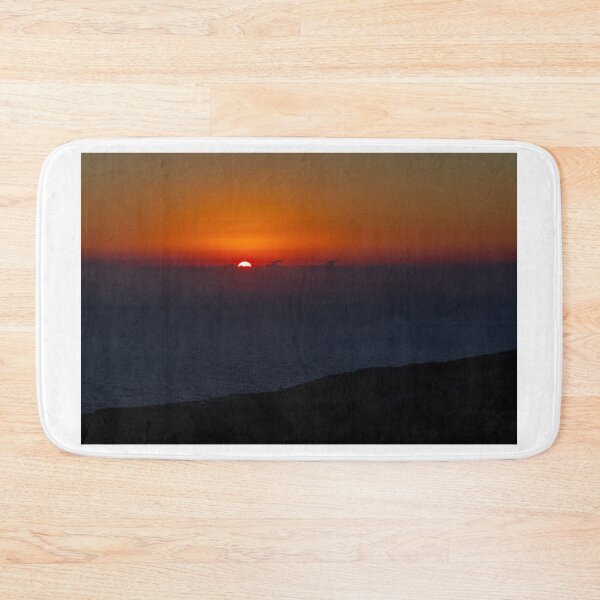 Item preview, Dramatic Orange Sunset Over Calm Ocean Horizon With Silhouetted Coastal Landscape At Dusk designed and sold by Nmallia.