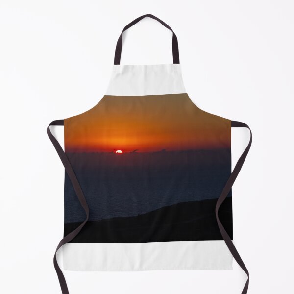 Item preview, Dramatic Orange Sunset Over Calm Ocean Horizon With Silhouetted Coastal Landscape At Dusk designed and sold by Nmallia.