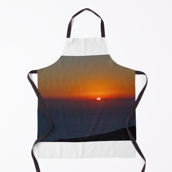 Item preview, Dramatic Orange Sunset Over Calm Ocean Horizon With Silhouetted Coastal Landscape At Dusk designed and sold by Nmallia.