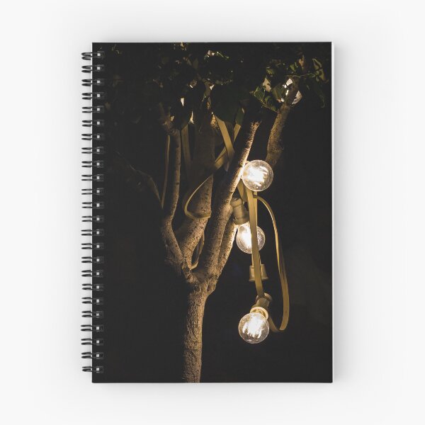 Item preview, Warm Glowing String Lights Draped On Tree Branches At Night For Cozy Outdoor Ambience designed and sold by Nmallia.
