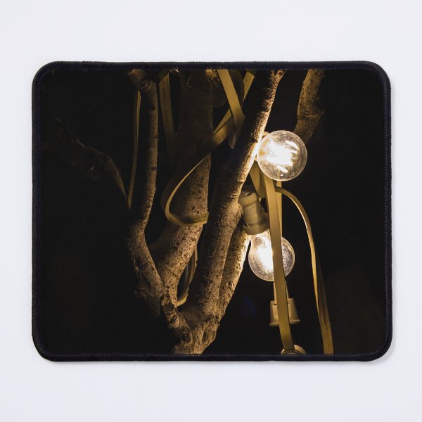 Item preview, Warm Glowing String Lights Draped On Tree Branches At Night For Cozy Outdoor Ambience designed and sold by Nmallia.