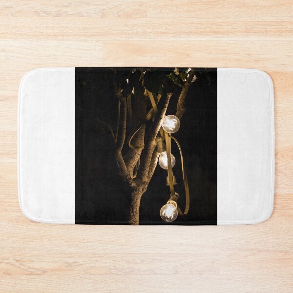 Item preview, Warm Glowing String Lights Draped On Tree Branches At Night For Cozy Outdoor Ambience designed and sold by Nmallia.