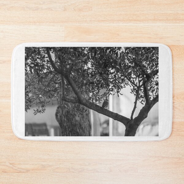 Item preview, Small Bird Perched On Tree Branch In Quiet Black And White Urban Garden designed and sold by Nmallia.