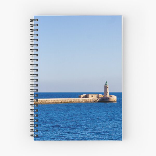 Item preview, Lighthouse on a Stone Pier Over Calm Blue Sea Under Clear Sky at Coastal Breakwater designed and sold by Nmallia.