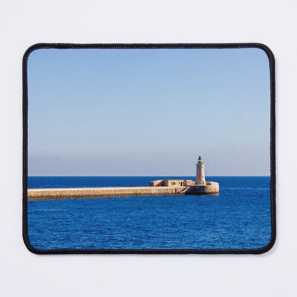 Item preview, Lighthouse on a Stone Pier Over Calm Blue Sea Under Clear Sky at Coastal Breakwater designed and sold by Nmallia.