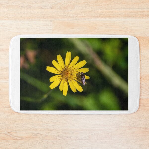 Item preview, Yellow Wildflower With Iridescent Bee Pollinating Bright Petals On Green Natural Background designed and sold by Nmallia.