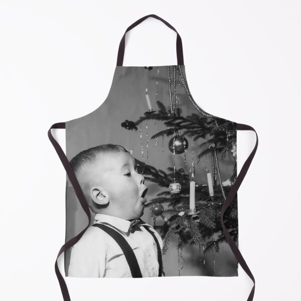 Item preview, Boy Blowing Out Candle on Christmas Tree, Vintage Black and White Old Photo designed and sold by IconicArchive.