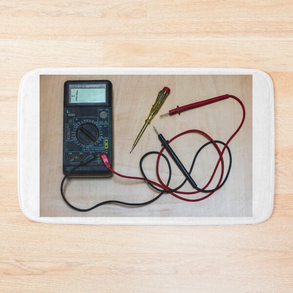 Item preview, Digital Multimeter With Red and Black Probes and Screwdriver On Wooden Workbench for Electronics Measurement and Repair designed and sold by Nmallia.