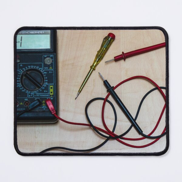 Item preview, Digital Multimeter With Red and Black Probes and Screwdriver On Wooden Workbench for Electronics Measurement and Repair designed and sold by Nmallia.