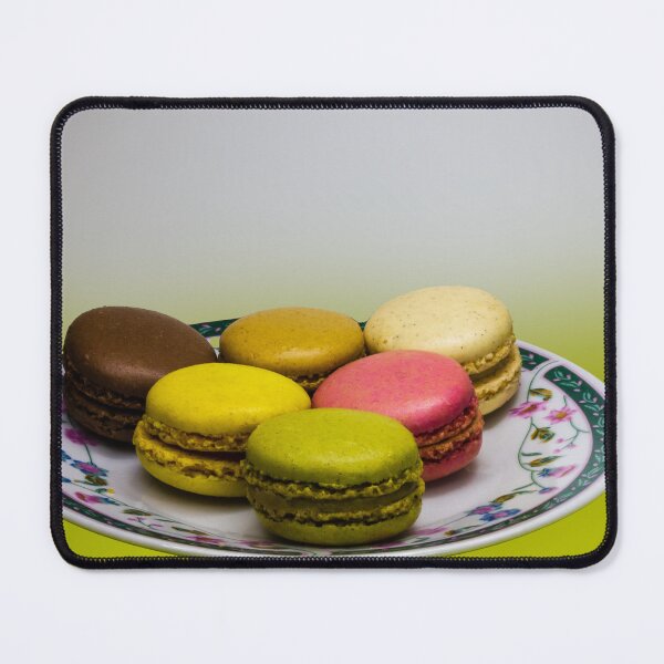Item preview, Colorful French Macarons Assorted On A Decorative Plate Over Green Background designed and sold by Nmallia.