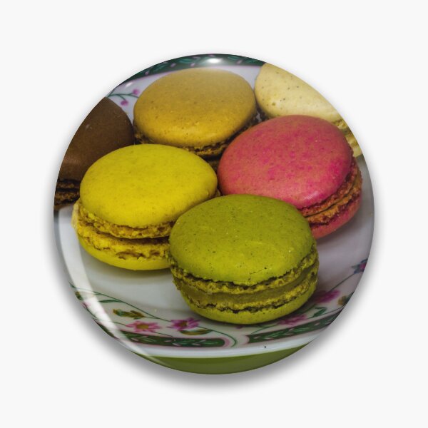 Item preview, Colorful French Macarons Assorted On A Decorative Plate Over Green Background designed and sold by Nmallia.