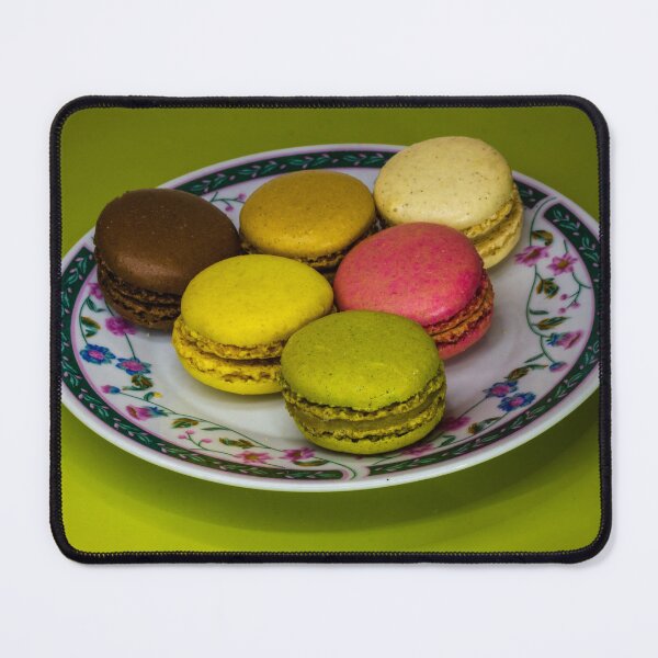 Item preview, Colorful French Macarons Assorted On A Decorative Plate Over Green Background designed and sold by Nmallia.