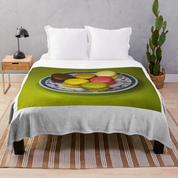 Item preview, Colorful French Macarons Assorted On A Decorative Plate Over Green Background designed and sold by Nmallia.