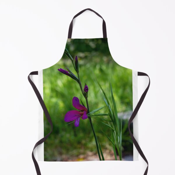 Item preview, Purple Wildflower Blooming Among Green Grass With Soft Bokeh Background In Spring Garden designed and sold by Nmallia.
