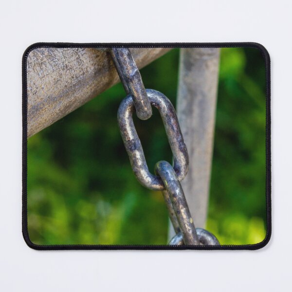 Item preview, Weathered Metal Chain Links Hanging From Gate Rail With Rusted Texture And Green Background designed and sold by Nmallia.