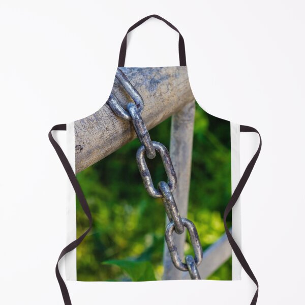 Item preview, Weathered Metal Chain Links Hanging From Gate Rail With Rusted Texture And Green Background designed and sold by Nmallia.