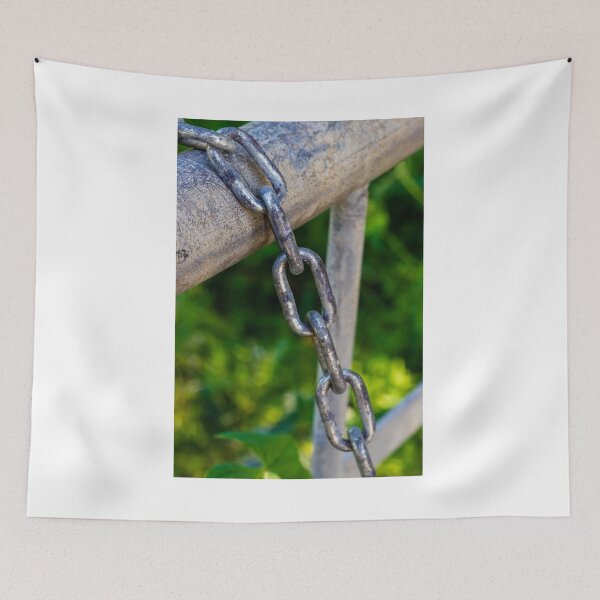 Item preview, Weathered Metal Chain Links Hanging From Gate Rail With Rusted Texture And Green Background designed and sold by Nmallia.