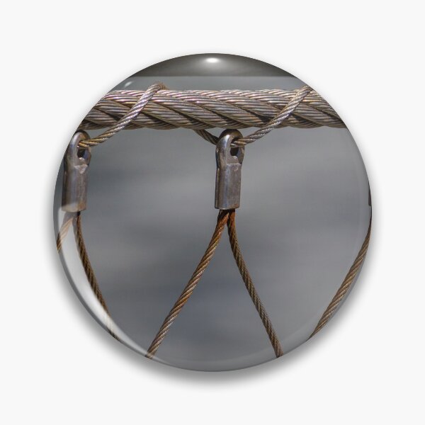 Item preview, Close-Up Of Metal Cable Wire Fence Netting With Industrial Clamps And Twisted Steel Ropes designed and sold by Nmallia.