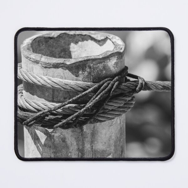 Item preview, Close-Up of Steel Cable and Rope Wrapped Around Weathered Mooring Post in Black and White designed and sold by Nmallia.