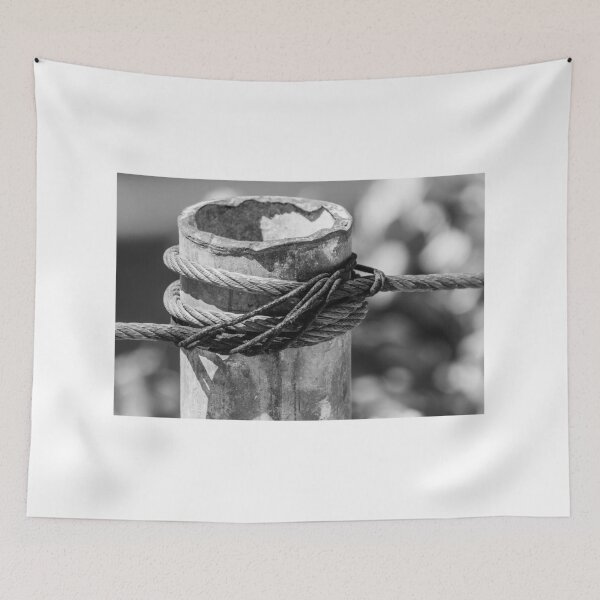 Item preview, Close-Up of Steel Cable and Rope Wrapped Around Weathered Mooring Post in Black and White designed and sold by Nmallia.