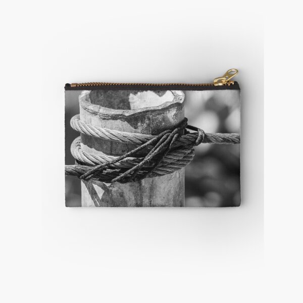 Item preview, Close-Up of Steel Cable and Rope Wrapped Around Weathered Mooring Post in Black and White designed and sold by Nmallia.