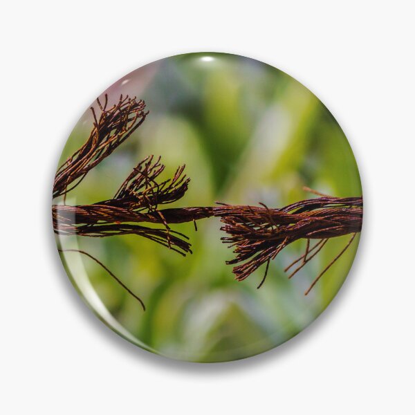 Item preview, Close-Up Of Frayed Rusty Wire Rope Breaking Under Tension Against Green Blurred Background designed and sold by Nmallia.