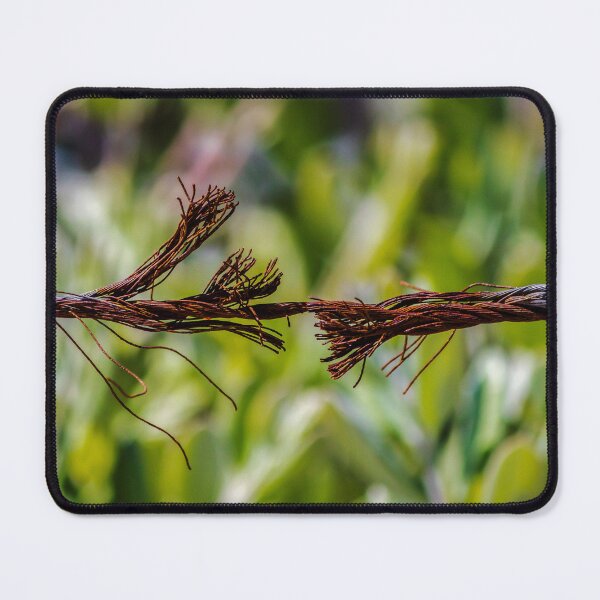 Item preview, Close-Up Of Frayed Rusty Wire Rope Breaking Under Tension Against Green Blurred Background designed and sold by Nmallia.