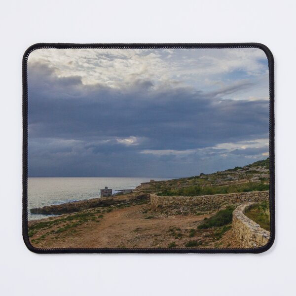 Item preview, Rocky Coastal Cliffs Overlooking Turquoise Sea Under Moody Cloudy Sky With Old Stone Structures designed and sold by Nmallia.