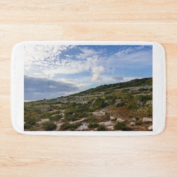 Item preview, Rocky Terraced Hillside With Dry Stone Walls and Coastal Mediterranean Landscape Under Blue Sky designed and sold by Nmallia.