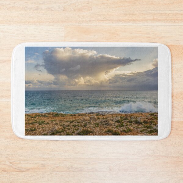 Item preview, Dramatic Cloud Over Ocean Horizon With Waves Crashing On Rocky Shore At Sunset designed and sold by Nmallia.