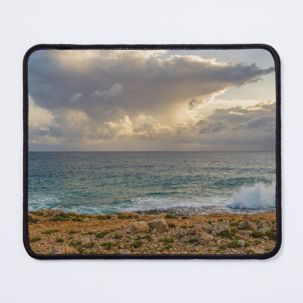 Item preview, Dramatic Cloud Over Ocean Horizon With Waves Crashing On Rocky Shore At Sunset designed and sold by Nmallia.