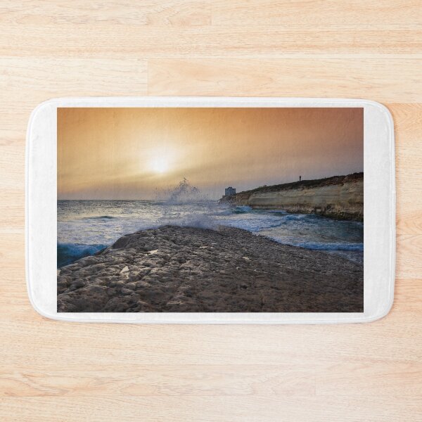 Item preview, Sunset Over Rocky Coastline With Waves, Cliff Fort And Distant Lighthouse On Calm Sea designed and sold by Nmallia.