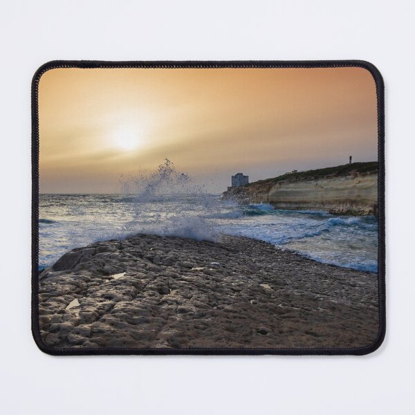 Item preview, Sunset Over Rocky Coastline With Waves, Cliff Fort And Distant Lighthouse On Calm Sea designed and sold by Nmallia.