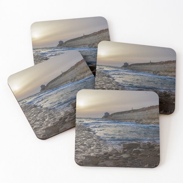Item preview, Sunset Over Rocky Coastline With Waves, Cliff Fort And Distant Lighthouse On Calm Sea designed and sold by Nmallia.