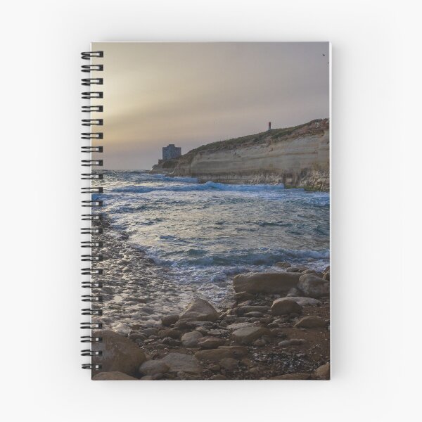 Item preview, Sunset Over Rocky Coastline With Waves, Cliff Fort And Distant Lighthouse On Calm Sea designed and sold by Nmallia.