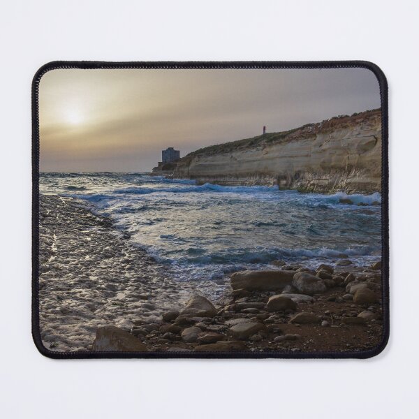 Item preview, Sunset Over Rocky Coastline With Waves, Cliff Fort And Distant Lighthouse On Calm Sea designed and sold by Nmallia.