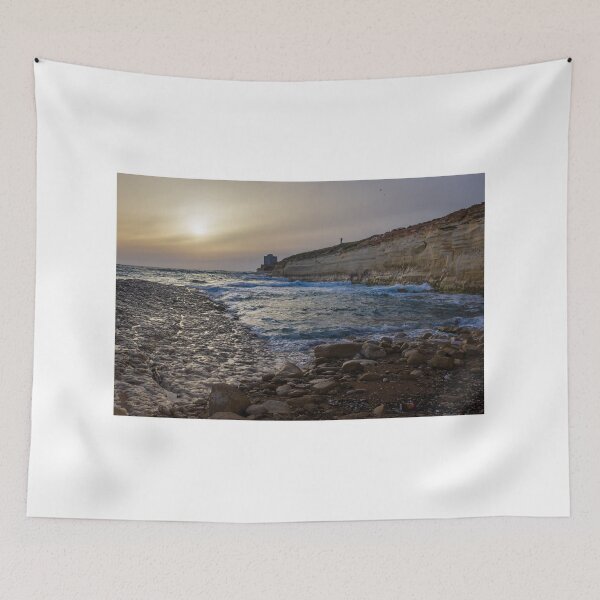 Item preview, Sunset Over Rocky Coastline With Waves, Cliff Fort And Distant Lighthouse On Calm Sea designed and sold by Nmallia.