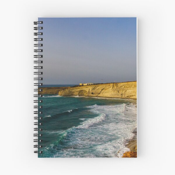 Item preview, Golden Coastal Cliffs Over Turquoise Sea With Waves Crashing Along A Remote Rocky Shoreline designed and sold by Nmallia.