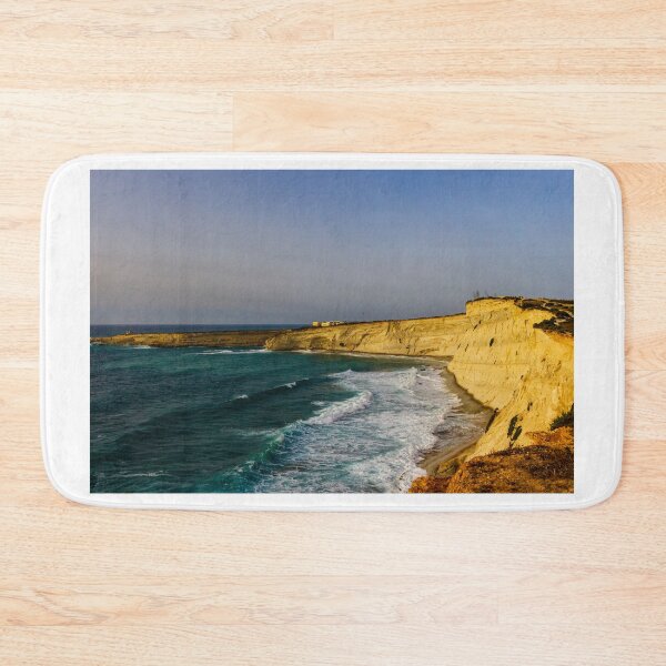 Item preview, Golden Coastal Cliffs Over Turquoise Sea With Waves Crashing Along A Remote Rocky Shoreline designed and sold by Nmallia.