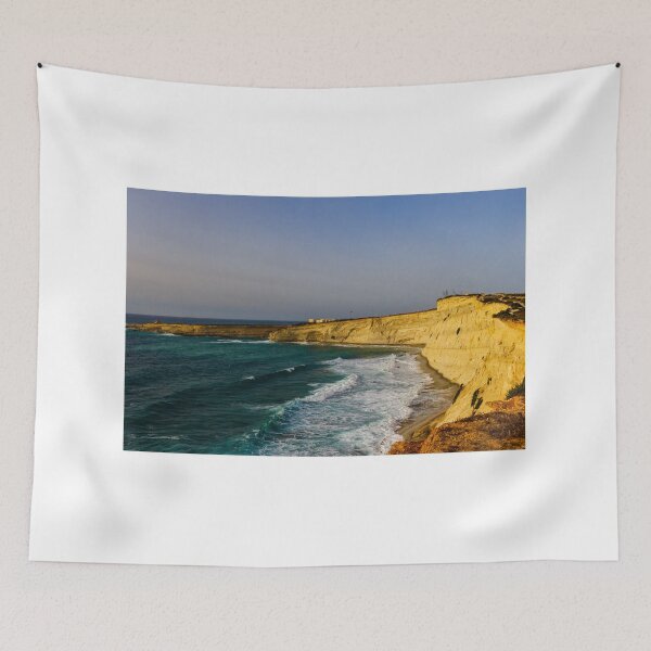 Item preview, Golden Coastal Cliffs Over Turquoise Sea With Waves Crashing Along A Remote Rocky Shoreline designed and sold by Nmallia.