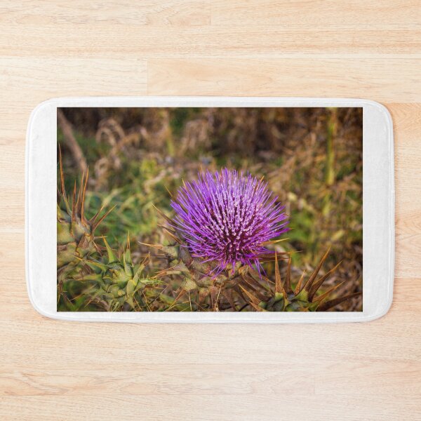 Item preview, Vibrant Purple Thistle Flower With Spiky Leaves Closeup In Natural Wildflower Habitat designed and sold by Nmallia.