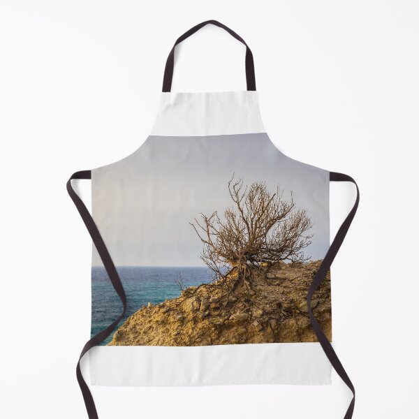 Item preview, Lonely Coastal Shrub Clinging to Rocky Cliff Overlooking Turquoise Sea at Sunset designed and sold by Nmallia.