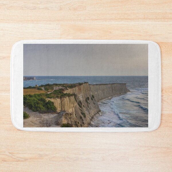 Item preview, Dramatic Coastal Cliffs Overlooking Rolling Sea Waves at Sunset With Rugged Vegetation and Path designed and sold by Nmallia.